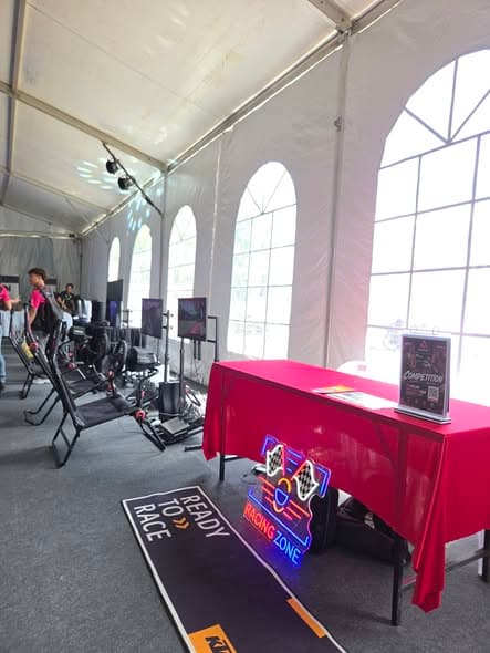 Families trying esports activities at a community event in Kota Kinabalu